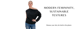 Blond tall curvy woman wearing a black sustainable stylish open shoulder vegan cupro fabric top