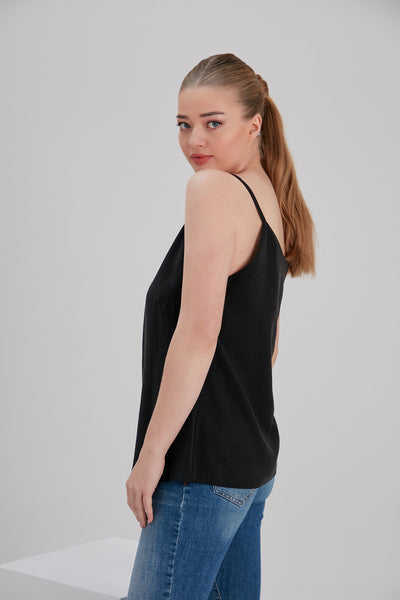 tall blond woman wearing noacode size inclusive ethically made tencel top with denim side look